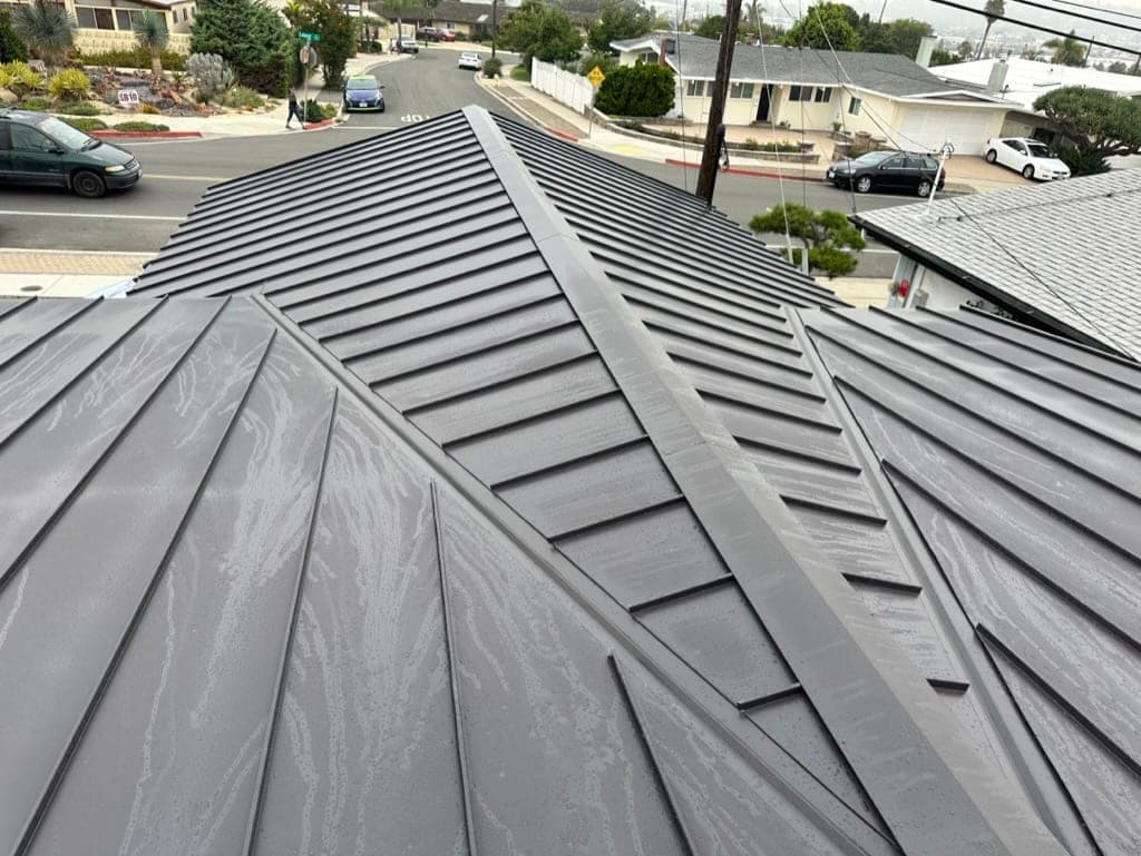 Chula Vista South Bay home with a metal roof under clear sky