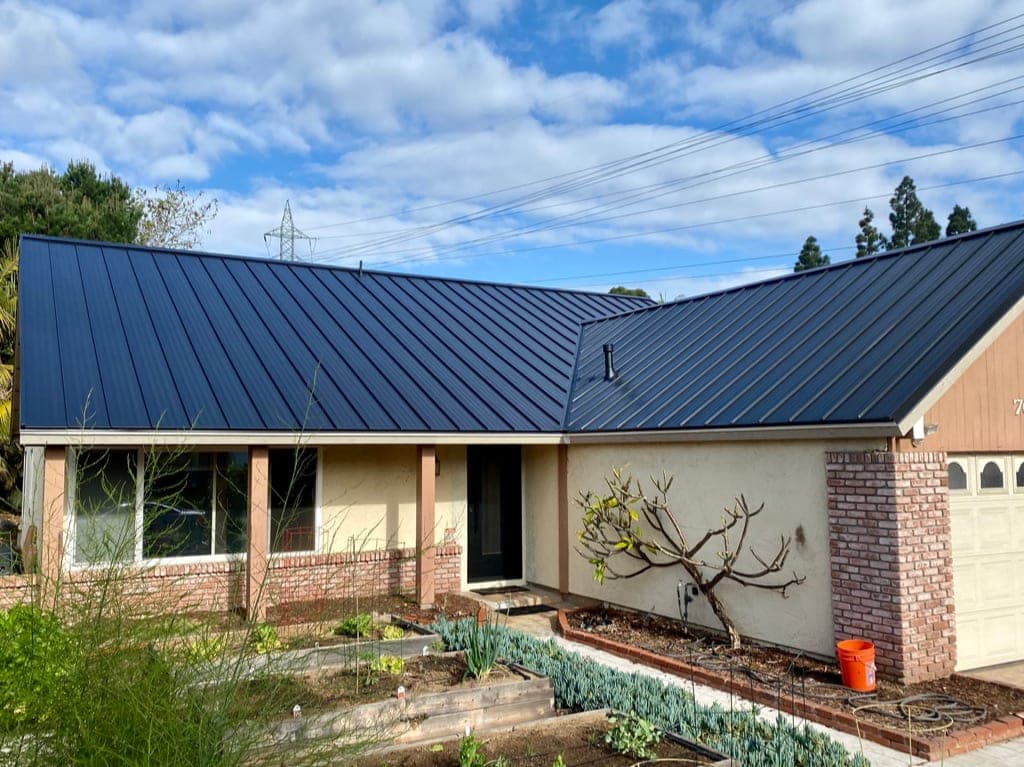 El Cajon valley home with a metal roof under warm East County light